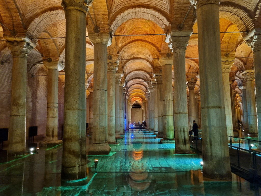 View of the ancient columns inside the Basilica Cistern, where the modern lighting added during the recent restoration creates a striking contrast between the red ceiling and green waters. photo by Serhat Engul